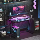 HOMCOM Gaming Desk with LED Lights and Power Outlets, 100 x 60cm Z Shaped Computer Desk with Monitor Stand and Steel Frame, PC Gaming Table for Home Office, Black image 1