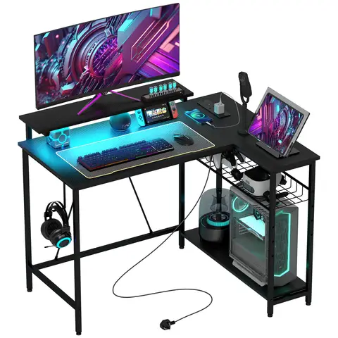 HOMCOM L Shaped Gaming Desk with LED Lights, Power Outlet, USB Charging Ports, 107cm Reversible Corner Computer Desk with Storage Shelves, Monitor Stand for Home Office, Small Space, Black