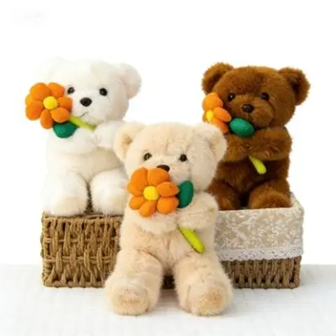 Peluche Ours tenant une fleur orange modèle aléatoire - 30 cm