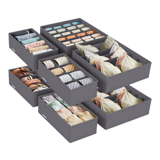 A set of grey fabric drawer organisers with different compartment sizes for socks, underwear, and bras.