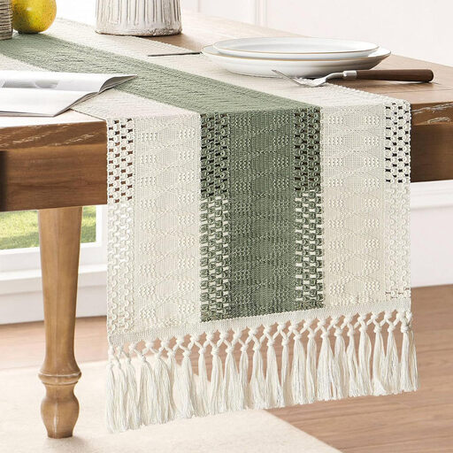 A boho-style olive green and ivory macrame table runner and placemat set