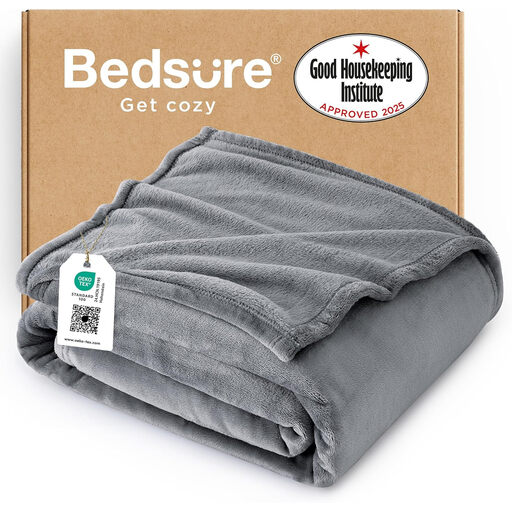 A soft, silver grey fleece throw blanket neatly folded