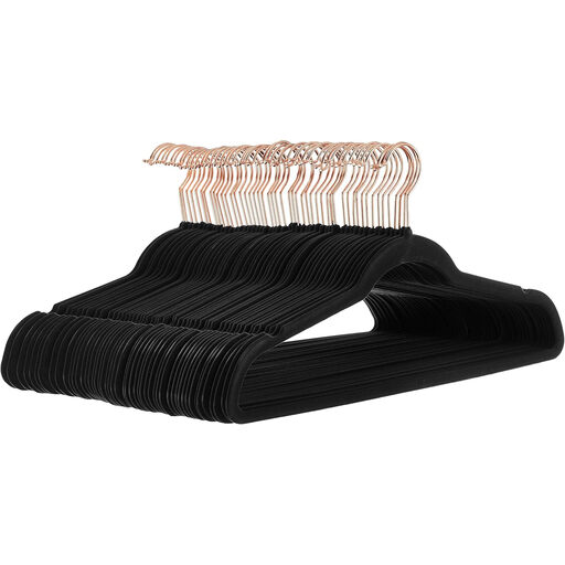 A pack of black velvet clothes hangers with rose gold hooks