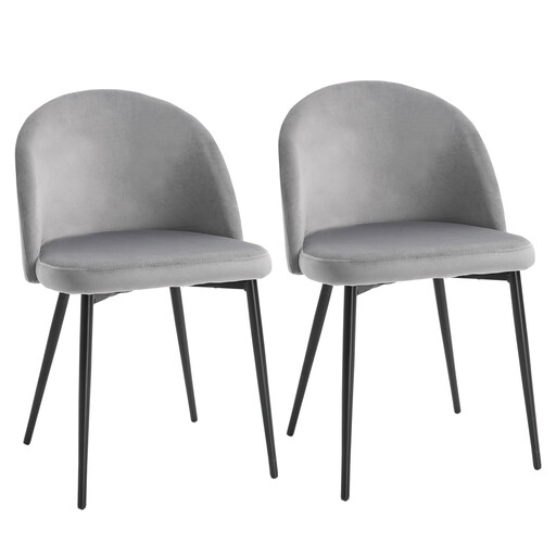 A pair of grey velvet dining chairs with black metal legs