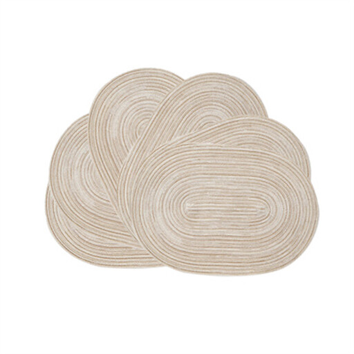 A set of six oval braided placemats in a neutral milk coffee colour