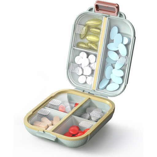 A green, circular pill organiser with seven compartments