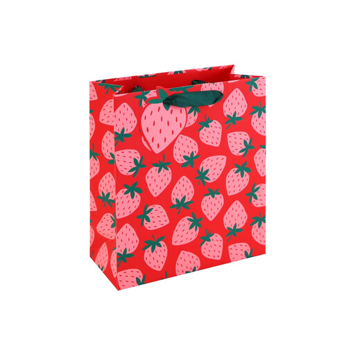A medium gift bag featuring a playful pattern of neon pink strawberries and green leaves.