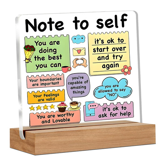 A clear acrylic plaque with colourful text and a wooden base, featuring affirmations like "You are worthy" and "It's ok to ask for help".