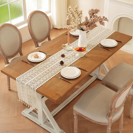 Boho crochet table runner and placemat set on a wooden table